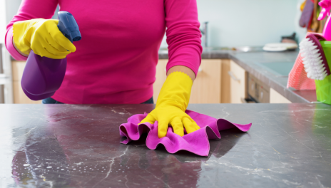 woman cleaning kitchen counter