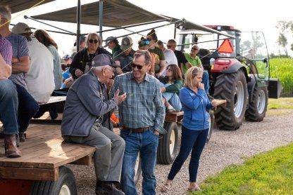 NDSU 总统 David Cook talks chats with a community member during Casselton Field Day